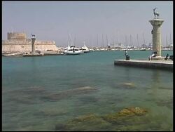 Rhodes, Greece: Harbor Entrance With Brass Deers and Fort Walls Stock Footage