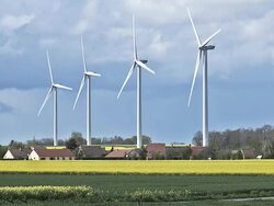 WS Wind Turbines in Countryside, Village near Caen / Vieux Pont, Normandy, France Stock Footage