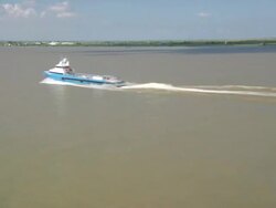 AERIAL WS One big boat passing on river / New Orleans, Louisiana, United States Stock Footage