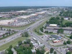 Suburban intersection with light traffic Stock Footage