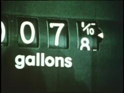 A driver pumps gas into his car. News Clip