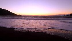 Wave on the beach at sunset  -4K- Stock Footage