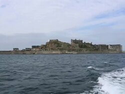WS POV View of Gunkanjima (Hashima Island),Under world heritage registration / Nagasaki, Nagasaki Prefecture, Japan Stock Footage