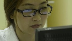 CLose up woman laboratory working on a computer Stock Footage