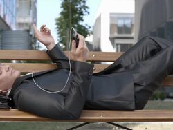 HD DOLLY: Yuppie Talking On Phone Outside Stock Footage