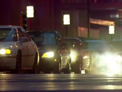 MS View of traffic moving and smoke and muffler / Minneapolis, Minnesota, United States Stock Footage