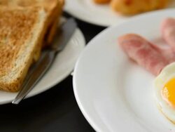 Ham breakfast served with coffee, toast and salads that taste good and smell the mold. Stock Footage