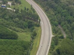 WS AERIAL View of cars running on highway / Rhone Alpes, France Stock Footage