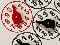 Timelapse power and energy a close up of the dials of an electricity meter rotate and zoom out Stock Footage