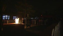 Participants add incense sticks to a temple fire in Beijing. Stock Footage