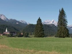 WS landscape with trees mountains fields and castle hotel / Garmisch, Bavaria, Germany Stock Footage