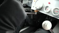 Stock-car driver shifts gears Stock Footage