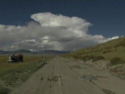 Block Shot tractor on mountainous road   Stock Footage