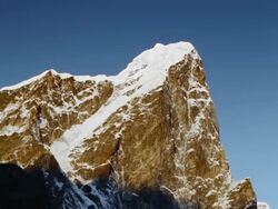 Panning shot of Time-lapse of the moon going behind Himalayan peaks in the morning. Stock Footage