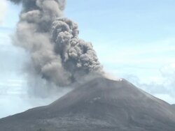Zoom out of eruption at Anak Krakatau to speed boat and tropical ocean, Krakatoa, Indonesia, November 2010 Stock Footage