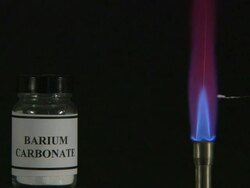 A flame test used in chemistry to detect the presence of certain metal ions, based on each elements characteristic emission spectrum (Barium Carbonate) Stock Footage