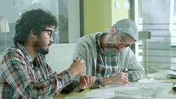 Young mans working together Stock Footage