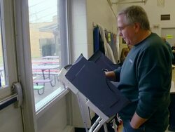 MS male voter casts ballot at copmuter terminal during voting inpresidential election Stock Footage