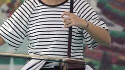 An actor playing a national musical instrument. Stock Footage