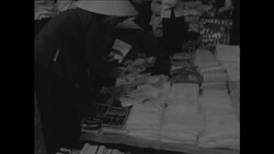 CAN664 BUSTLING MARKET PLACE IN SAIGON SELLING LOCAL PRODUCE AND AMERICAN IMPORTS Instructional Video