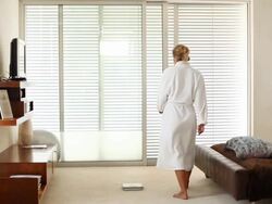 Beautiful woman weighing herself on scale Stock Footage