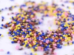 Colorful polymer granules falling Stock Footage