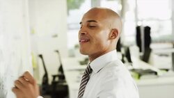 Businessman writing on whiteboard Stock Footage