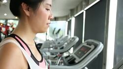 sport women running on treadmill cardio equipment Stock Footage