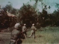 Soldiers in full uniform march in random order during Vietnam War Stock Footage