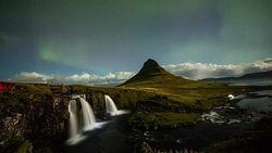 T/L Aurora Borealis over Kirkjufellsfoss waterfall Stock Footage