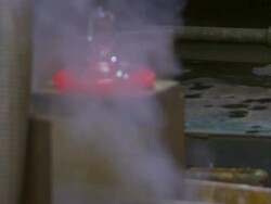 Forming Hot Glass in a Big Wood Block Closeup Stock Footage