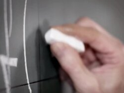 Professor writing on blackboard Stock Footage