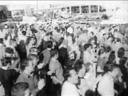 B/W 1950s high angle crowd of people clapping at pro-segregation rally / New Orleans, low angle / newsreel Stock Footage