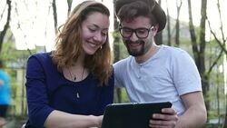 Couple making video chat on a tablet Stock Footage