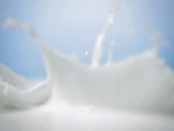 HD Super Slow-Mo: Chocolate Bars Splashing Into Milk Stock Footage