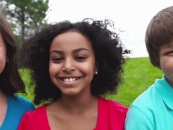 Four kids smile at the camera Stock Footage