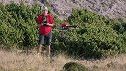 Man controlling the drone landing Stock Footage