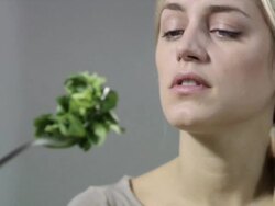 Woman with salad leaves on fork Stock Footage