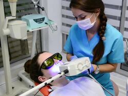 Tooth whitening in dentist office Stock Footage