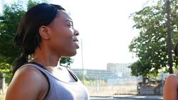 MS Smiling woman in discussion with friends after morning run Stock Footage