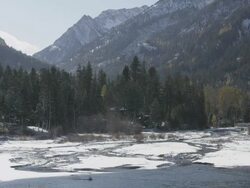 WS View of Snow melts and runs into Lake Wallowa as majestic mountains rise / Joseph, Oregon, United States  Stock Footage