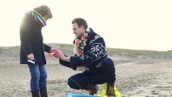 MS Father and son playing with kite on beach Stock Footage