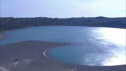 Water fills a volcanic crater on the Kamchatka Peninsula. Stock Footage