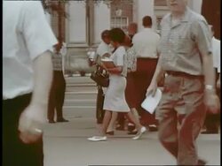 African-American Vivian Malone walks with a Caucasian girl at the University of Alabama, a 1963 victory for civil rights. Stock Footage