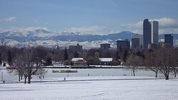 Winter Denver skyscrapers snowy City Park and Rocky Mountains Stock Footage