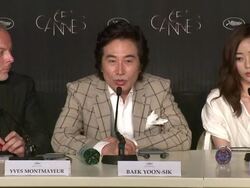 INTERVIEW: Baek Yoon-sik and Kim Kang-Woo on working with the director Do-nui Mat (The Taste Of Money)  Press Conference: 65th Cannes Film Festival on May 26, 2012 in Cannes, France (Footage by WireImage Video/Getty Images) Stock Footage