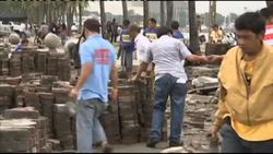 Filipinos cleaning up after typhoon News Clip