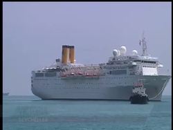 A disabled cruise ship arrived in port in the island nation of the Seychelles on Thursday morning after three days at sea without power. Video quality as incoming. News Clip