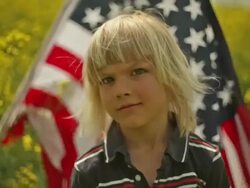 young boy displays his flag Stock Footage