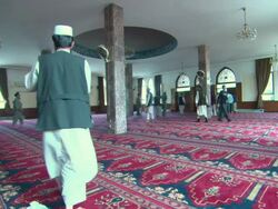 WS Men leaving  mosque after prayer AUDIO / Kabul, Kabul, Afghanistan Stock Footage